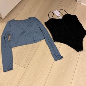 Two size extra large women’s items-one black bodysuit, and one blue crop top